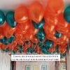 Loose helium balloons gold black white